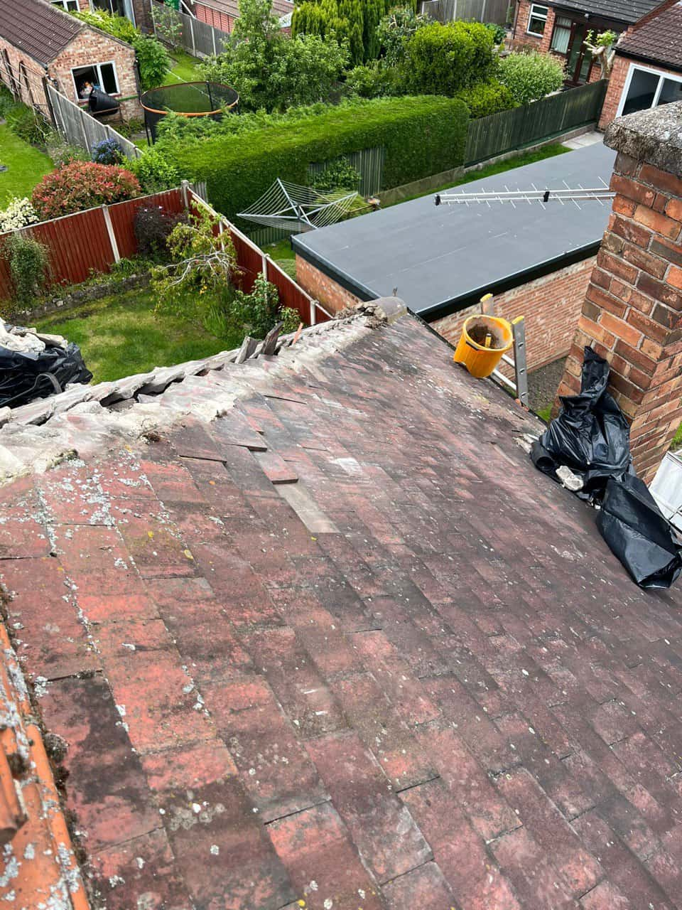 This is a photo of a roof where the hip tiles have been removed, and are just about to be replaced. Works carried out by Burton Joyce Roofing Repairs