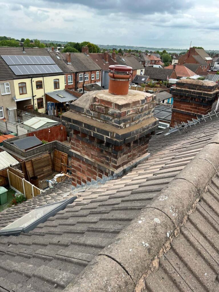 This is a photo taken from a roof which is being repaired by Burton Joyce Roofing Repairs, it shows a street of houses, and their roofs